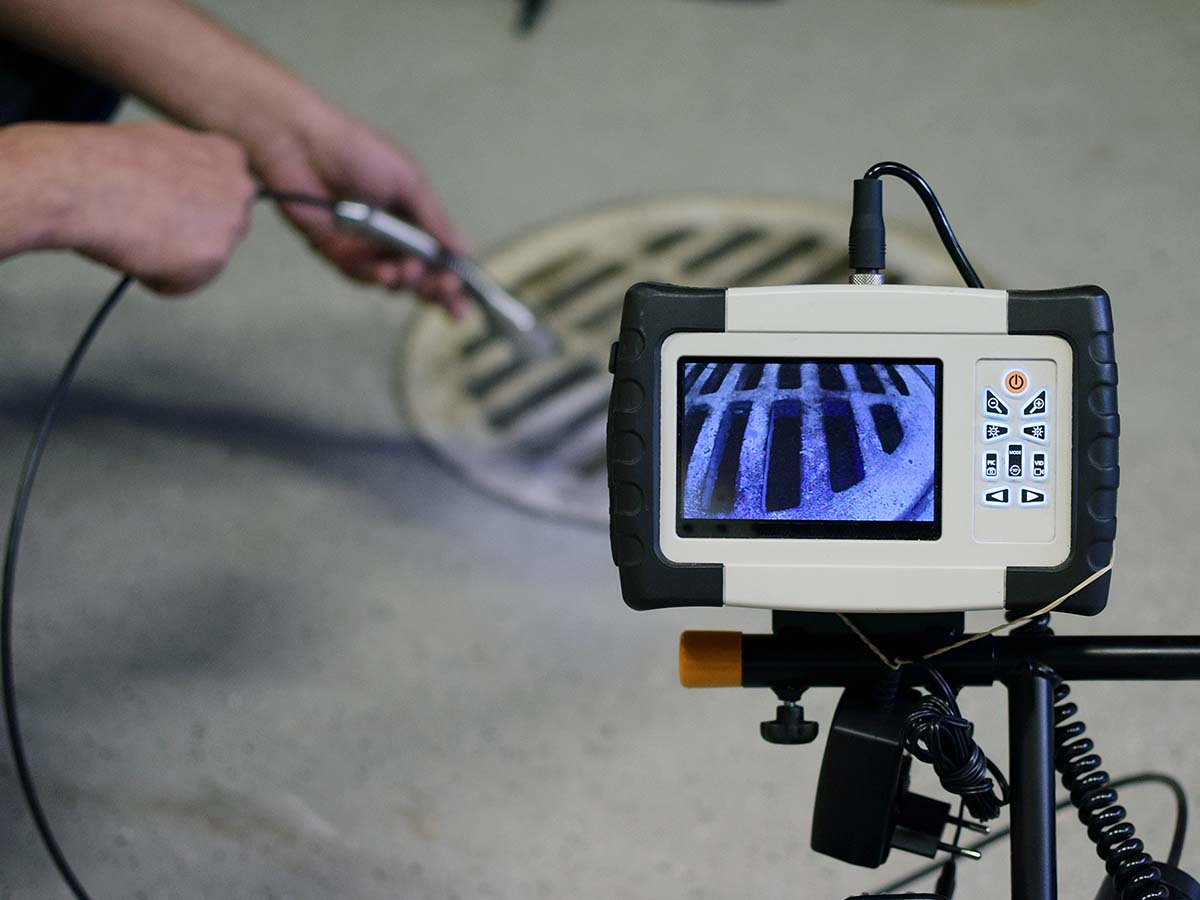 A plumber working with video surveillance.