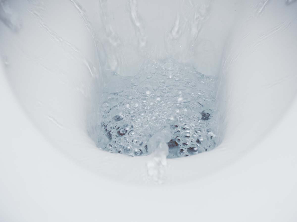 A clear, well-flowing toilet.