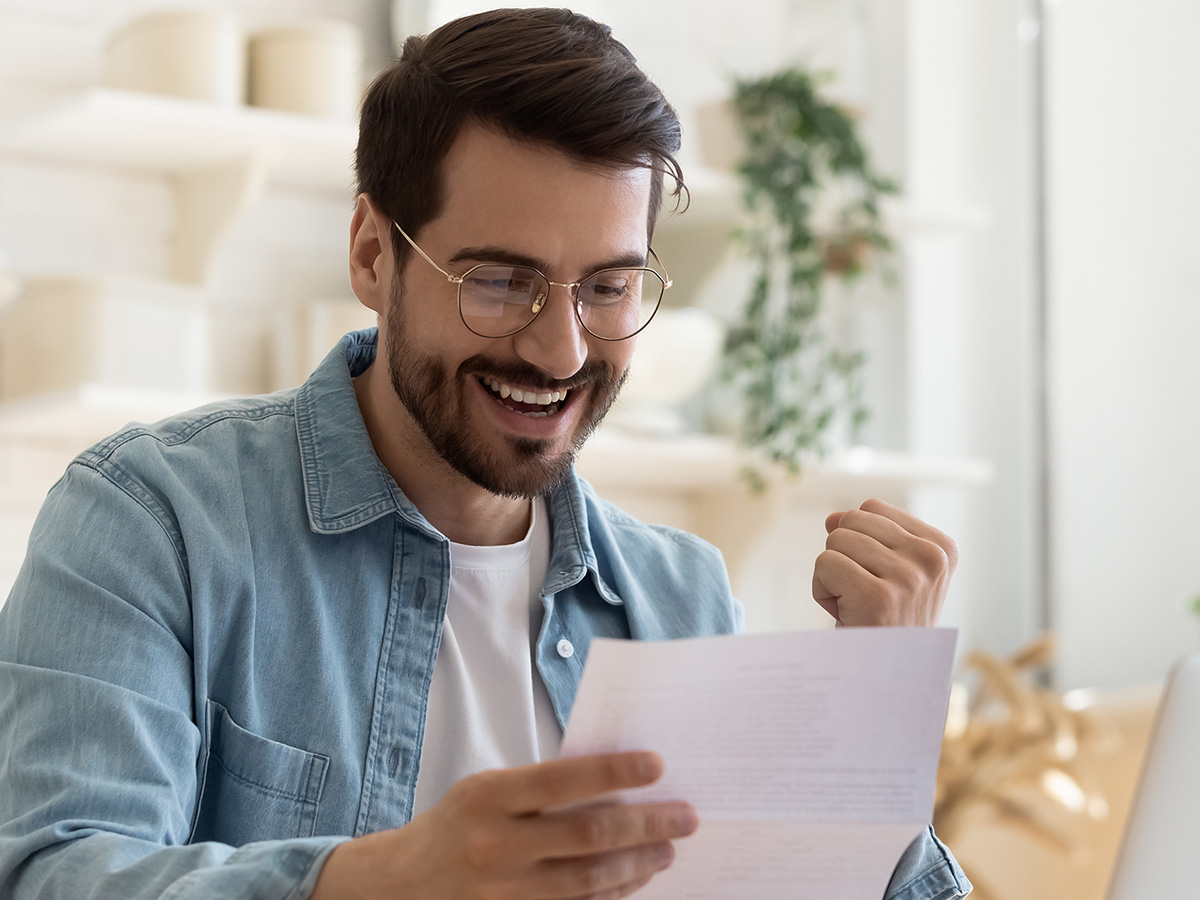 A man who is excited about his low monthly water bill