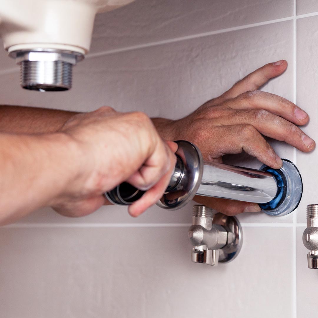 plumber installing pipes