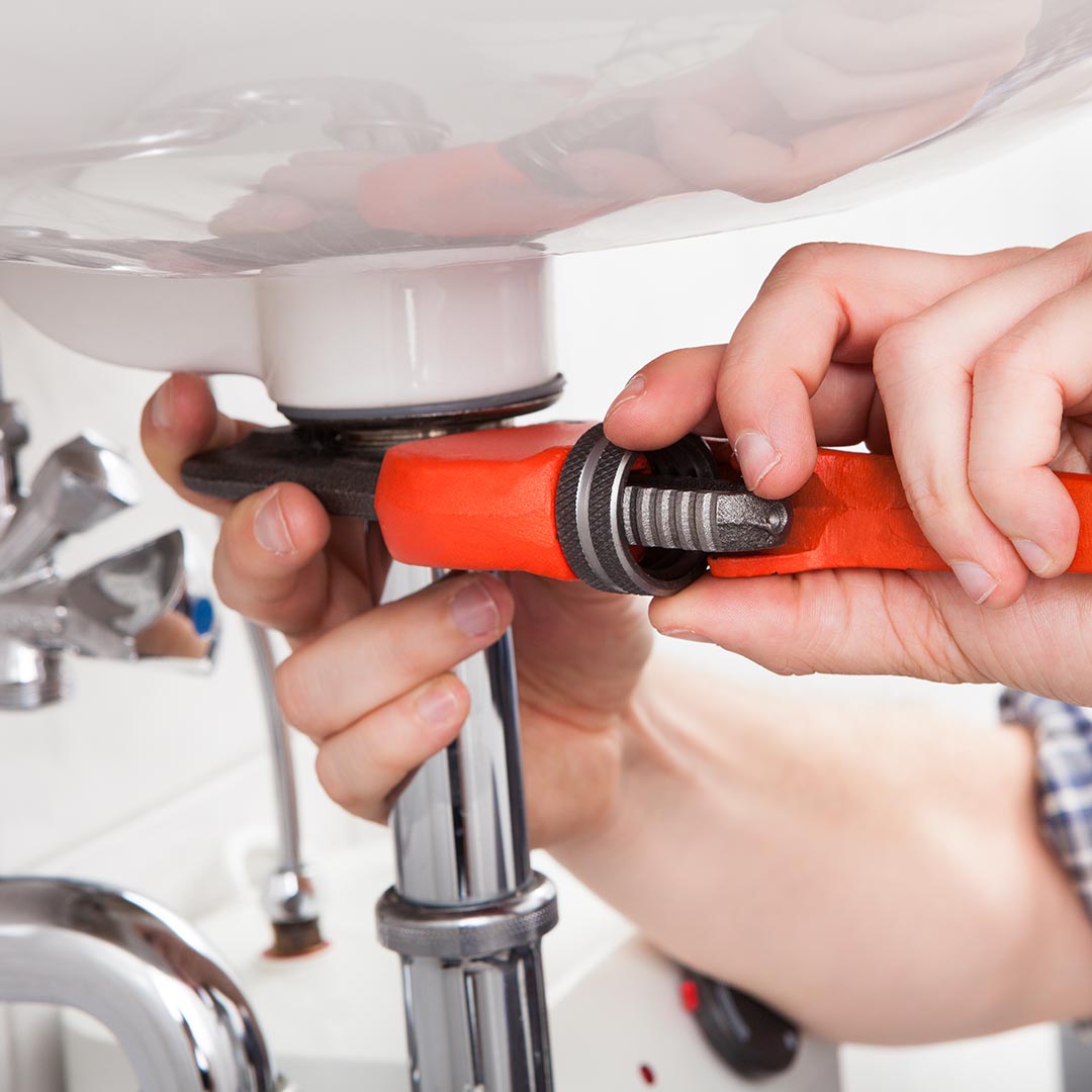 plumber tightening sink piping #1 plumbing company plumbing company in Nashville with best reviews