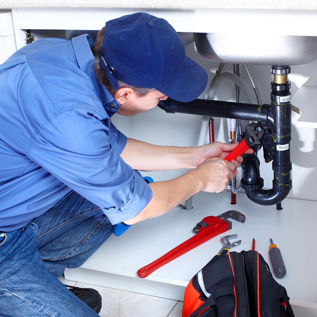 plumber fixing a sink #1 plumbing company plumbing company in Nashville with best reviews