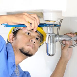 plumber fixing sink