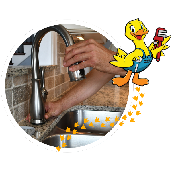 plumbing contractor fixing a leaky faucet